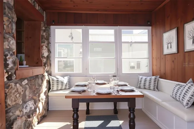a living room with furniture and windows