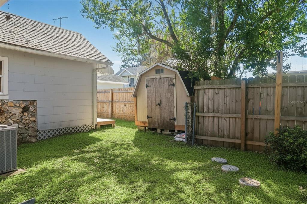 5353 10th Street Zephyrhills, FL 33542 - Photo 9 of 26 a front view of a house with garden