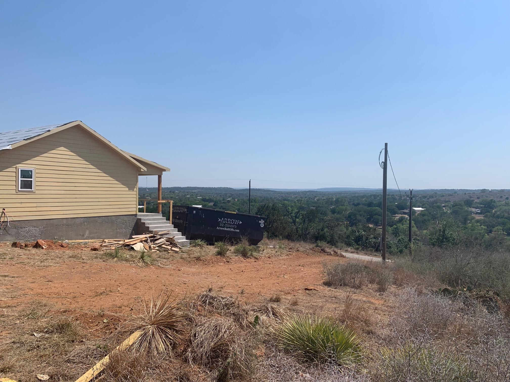 Sandy Mountain Drive Sunrise Beach, TX 78643 - Photo 7 of 14 a view of a house with a yard