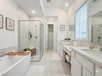 a spacious bathroom with a granite countertop tub sink shower and mirror
