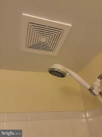 a bathroom with a sink vanity and a mirror