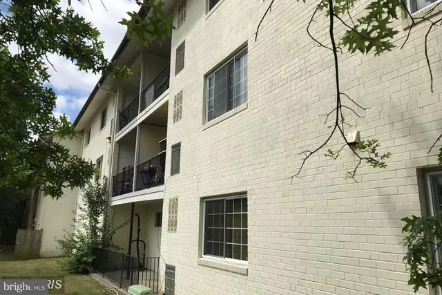 a view of a house with a tree