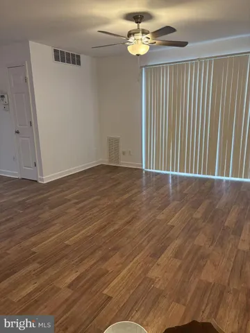 a view of an empty room with a chandelier