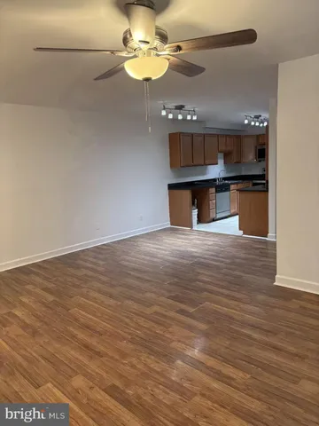a view of kitchen with microwave and cabinets
