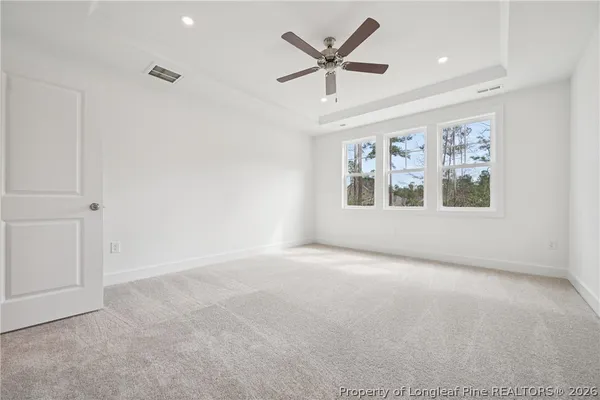 a view of a lake with a house in the background