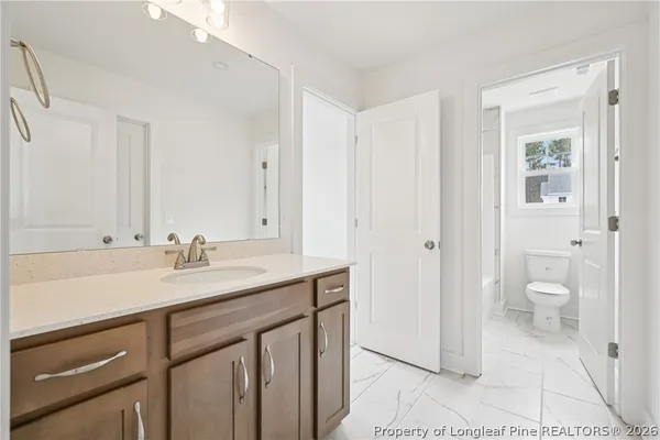 a backyard of a house with garden barbeque oven and outdoor seating