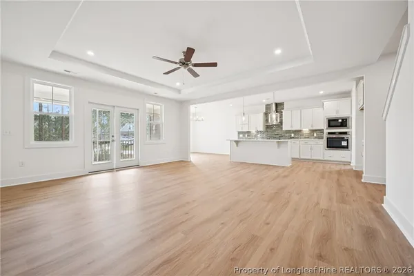 a kitchen with stainless steel appliances granite countertop a sink a stove and a refrigerator
