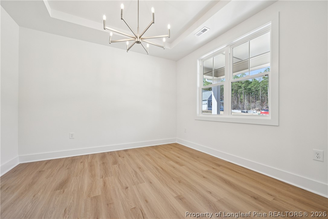 78 Graduate Ct Spring Lake Spring Lake, NC 28390 - Photo 6 of 43 an empty room with a window and a ceiling fan