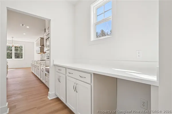 an aerial view of a house with a swimming pool