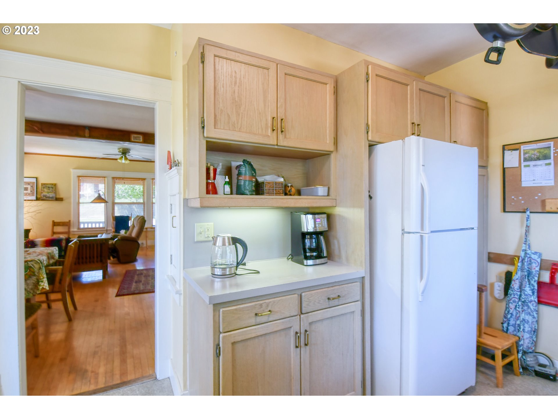 504 Northwest 8th Street Pendleton, OR 97801 - Photo 21 of 48 a kitchen with a refrigerator and cabinets