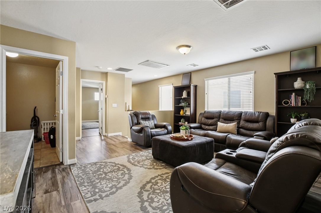 3957 East Carla Ann Road North Las Vegas, NV 89081 - Photo 15 of 35 Living room with dark wood-type flooring and baseboards