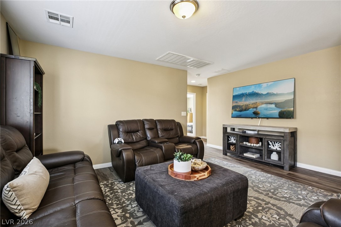 3957 East Carla Ann Road North Las Vegas, NV 89081 - Photo 16 of 35 Living area featuring baseboards and wood finished floors