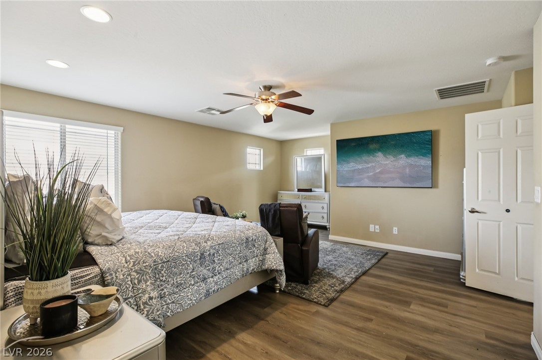 3957 East Carla Ann Road North Las Vegas, NV 89081 - Photo 19 of 35 Bedroom featuring dark wood finished floors and ceiling fan