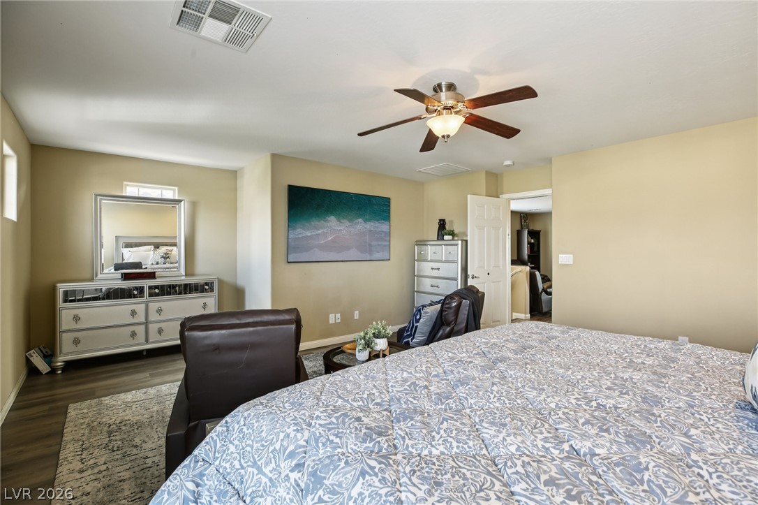 3957 East Carla Ann Road North Las Vegas, NV 89081 - Photo 20 of 35 Bedroom with ceiling fan and dark wood-style flooring