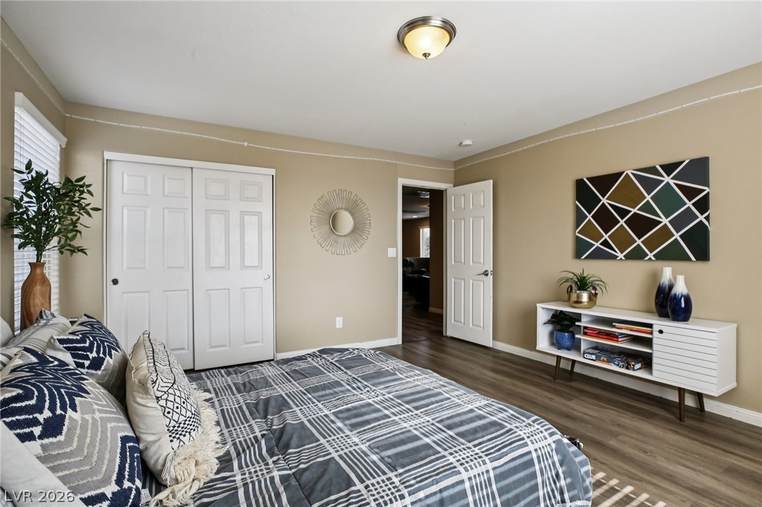 3957 East Carla Ann Road North Las Vegas, NV 89081 - Photo 27 of 35 Bedroom featuring a closet and dark wood finished floors