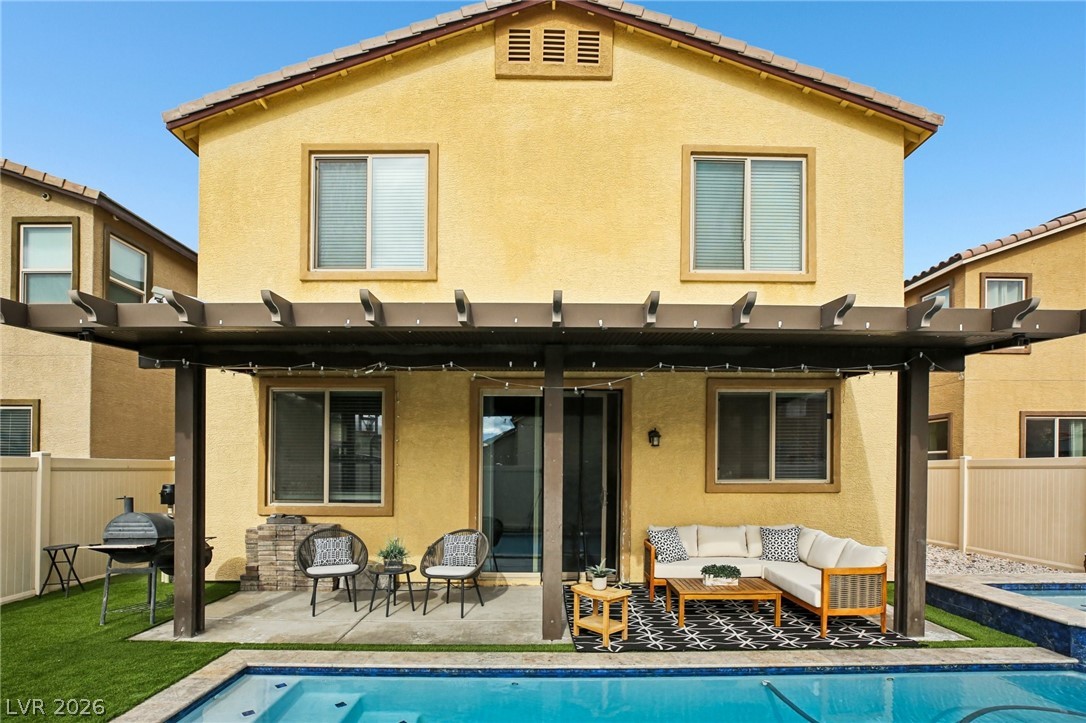 3957 East Carla Ann Road North Las Vegas, NV 89081 - Photo 30 of 35 Back of property featuring a fenced backyard, a patio, an outdoor living space, and stucco siding