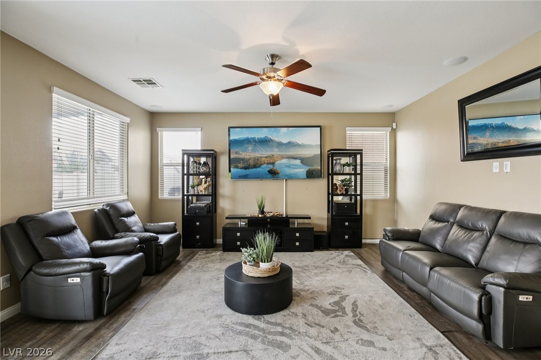 3957 East Carla Ann Road North Las Vegas, NV 89081 - Photo 7 of 35 Living room featuring a ceiling fan and dark wood-style floors