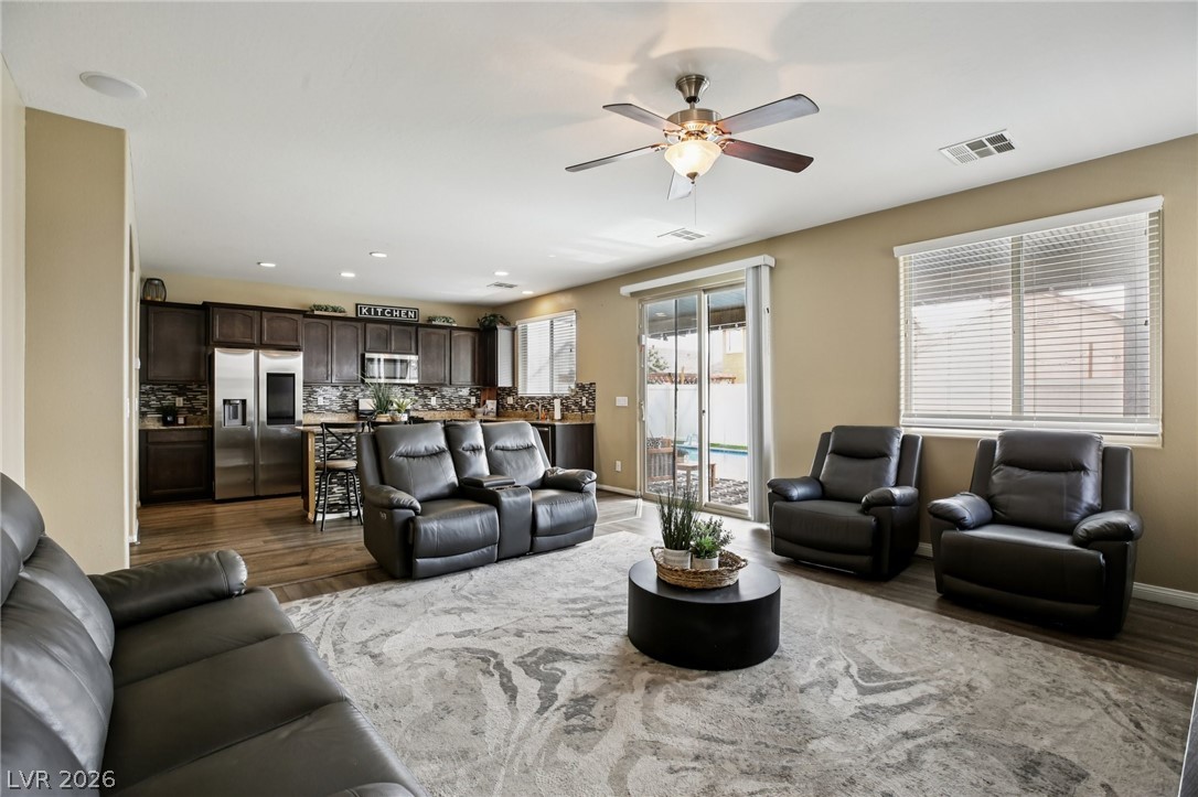 3957 East Carla Ann Road North Las Vegas, NV 89081 - Photo 9 of 35 Living room featuring wood finished floors, a ceiling fan, and recessed lighting