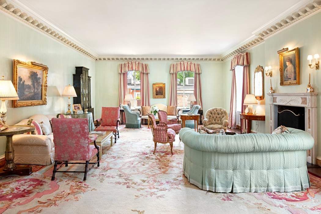 740 Park Avenue, Unit 6/7D Manhattan, NY 10021 - Photo 1 of 19 a living room with furniture and a fireplace