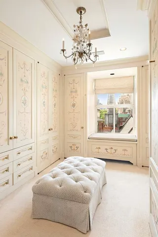 a spacious bedroom with a bed and a window