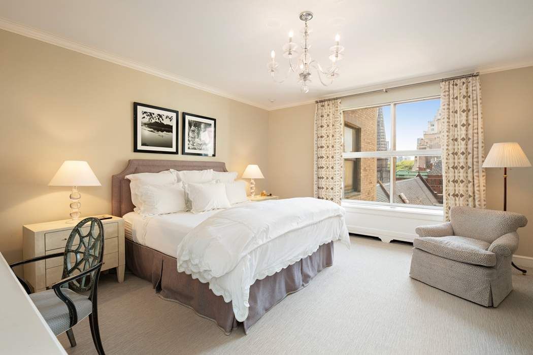 740 Park Avenue, Unit 6/7D Manhattan, NY 10021 - Photo 15 of 19 a spacious bedroom with a bed couch and window