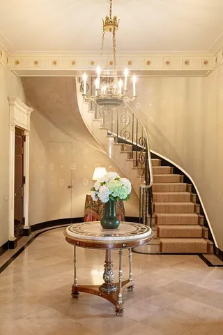 a view of entryway dining room and hall with wooden floor