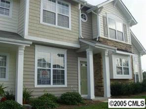 208 Dawn Mist Lane, Unit 208 Fort Mill, SC 29708 - Photo 1 of 6 a view of a brick building with large windows