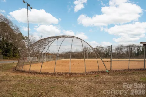 a view of a pathway both side of house