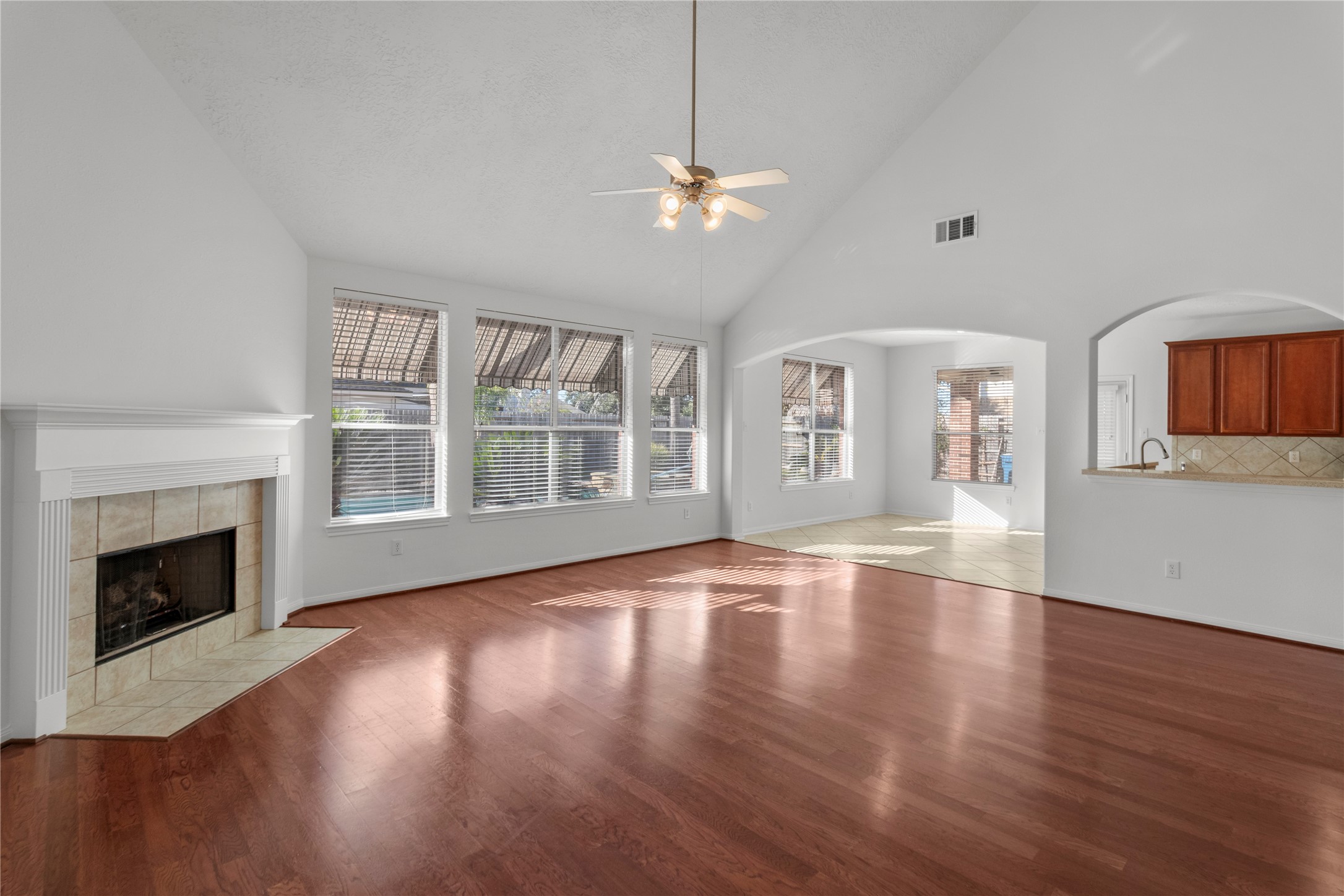 4004 Beacon Pointe Lane Dickinson, TX 77539 - Photo 14 of 28 a view of an empty room with wooden floor and a window