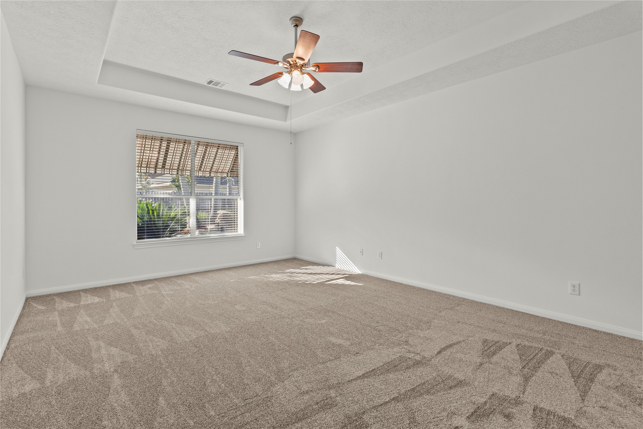 4004 Beacon Pointe Lane Dickinson, TX 77539 - Photo 16 of 28 an empty room with windows and ceiling fan