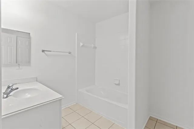 a bathroom with a sink and a bathtub