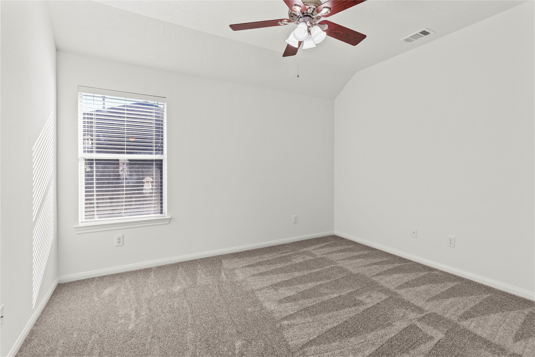 4004 Beacon Pointe Lane Dickinson, TX 77539 - Photo 23 of 28 an empty room with a window and a fan