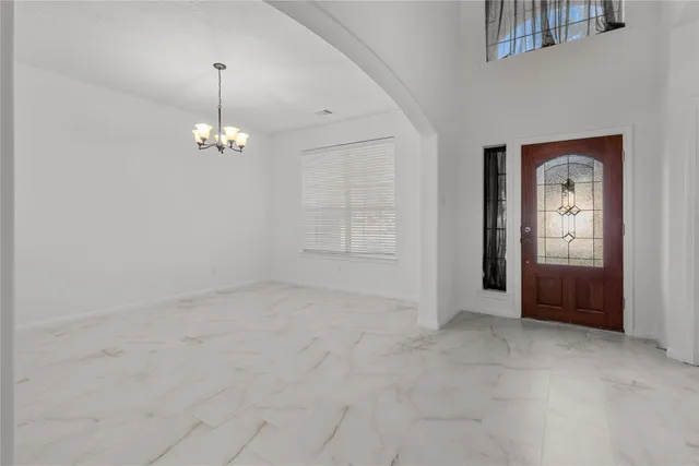 an empty room that has a mirror