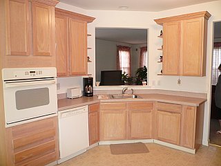 13 Tisdale Road Whiting, NJ 08759 - Photo 2 of 3 a kitchen with white cabinets and sink