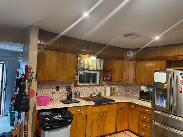 402 Frisco Street Houston, TX 77022 - Photo 7 of 11 a kitchen with a sink cabinets and stainless steel appliances