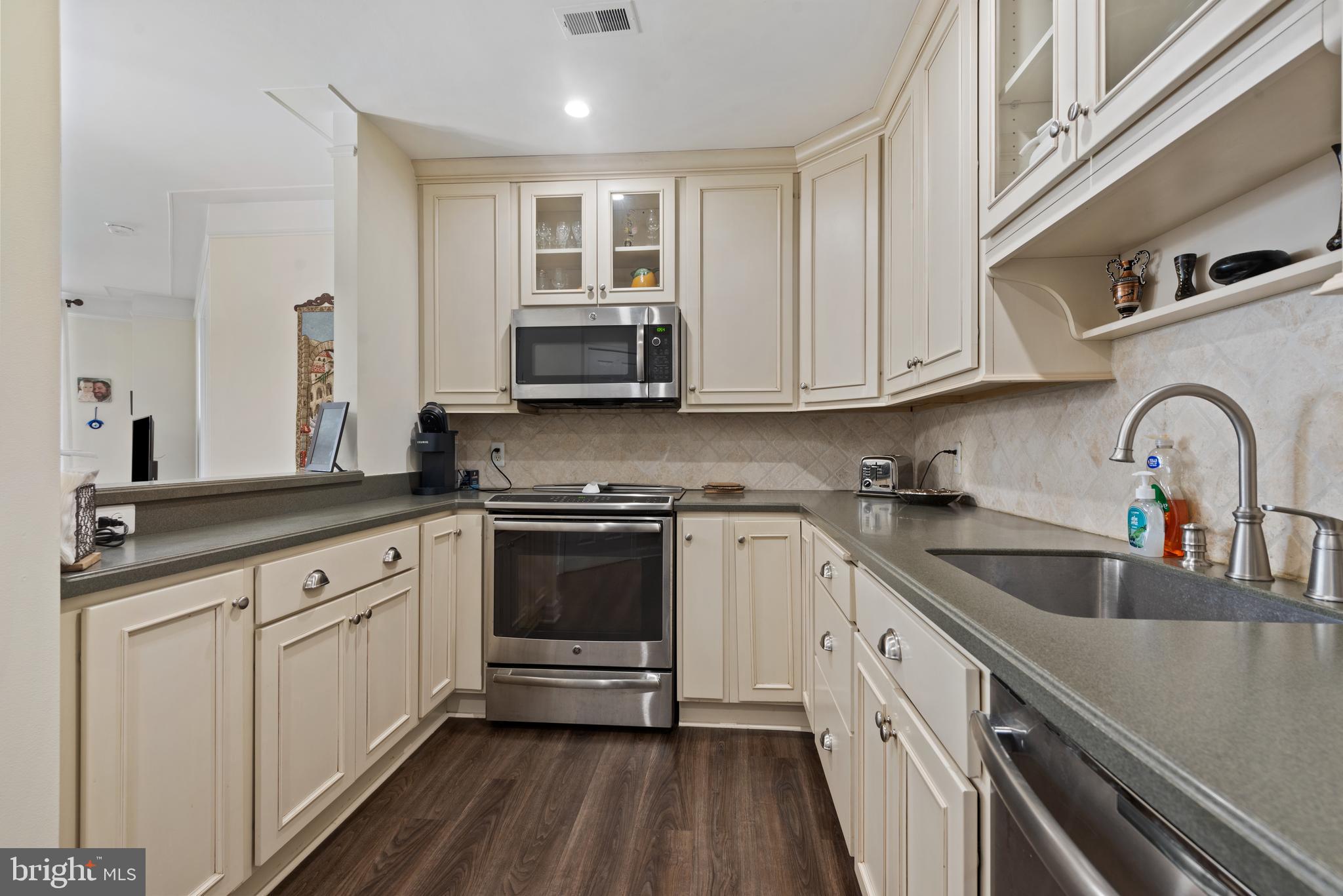 100 Harborview Drive, Unit 612 Baltimore, MD 21230 - Photo 16 of 49 a kitchen with stainless steel appliances granite countertop a sink and cabinets