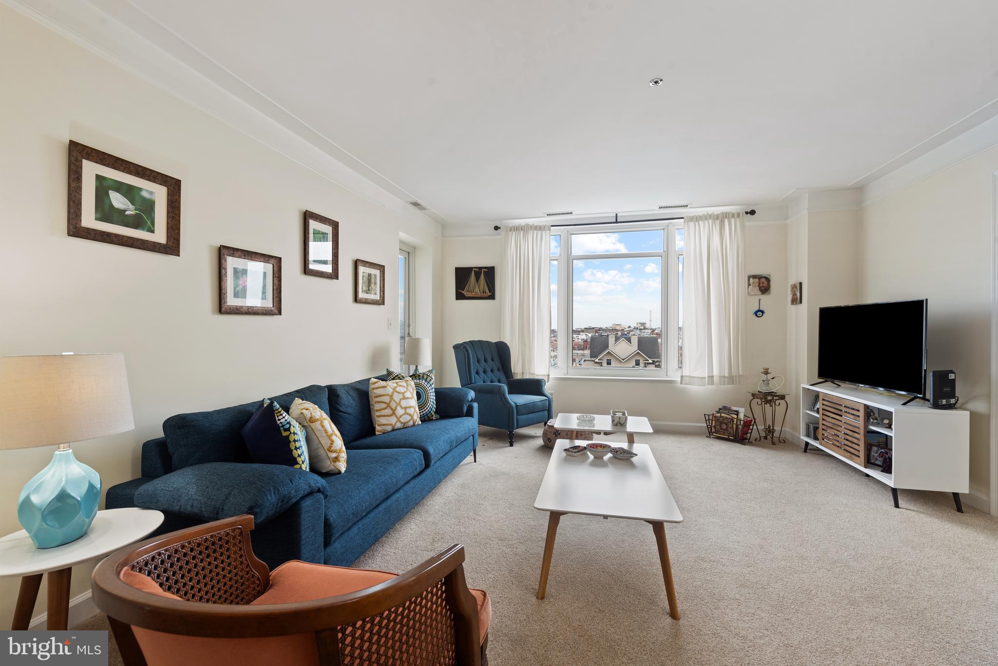 100 Harborview Drive, Unit 612 Baltimore, MD 21230 - Photo 3 of 49 a living room with furniture and a flat screen tv