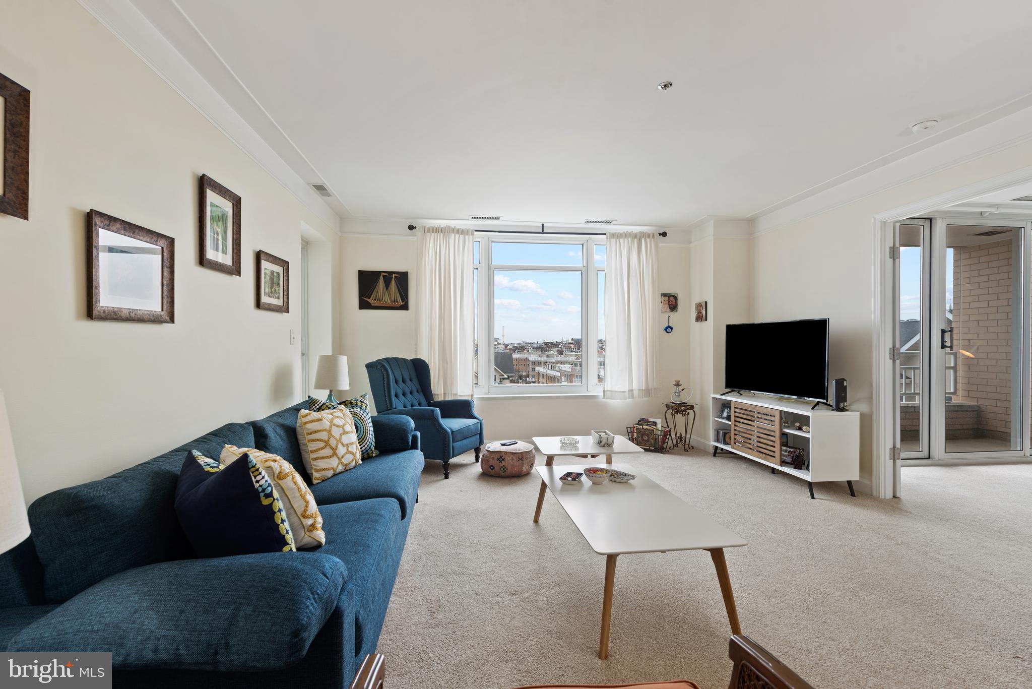 100 Harborview Drive, Unit 612 Baltimore, MD 21230 - Photo 4 of 49 a living room with furniture and a flat screen tv