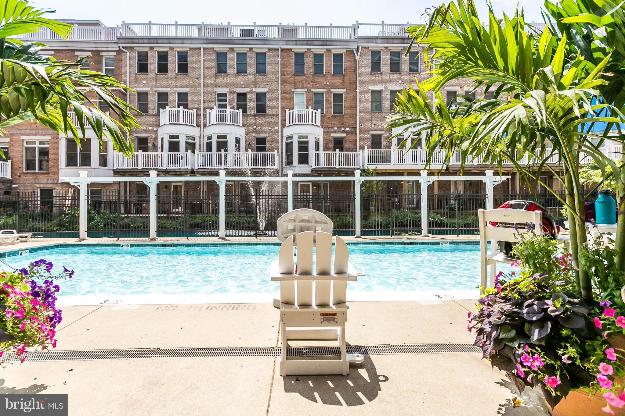 100 Harborview Drive, Unit 612 Baltimore, MD 21230 - Photo 44 of 49 a front view of a building with a garden and plants