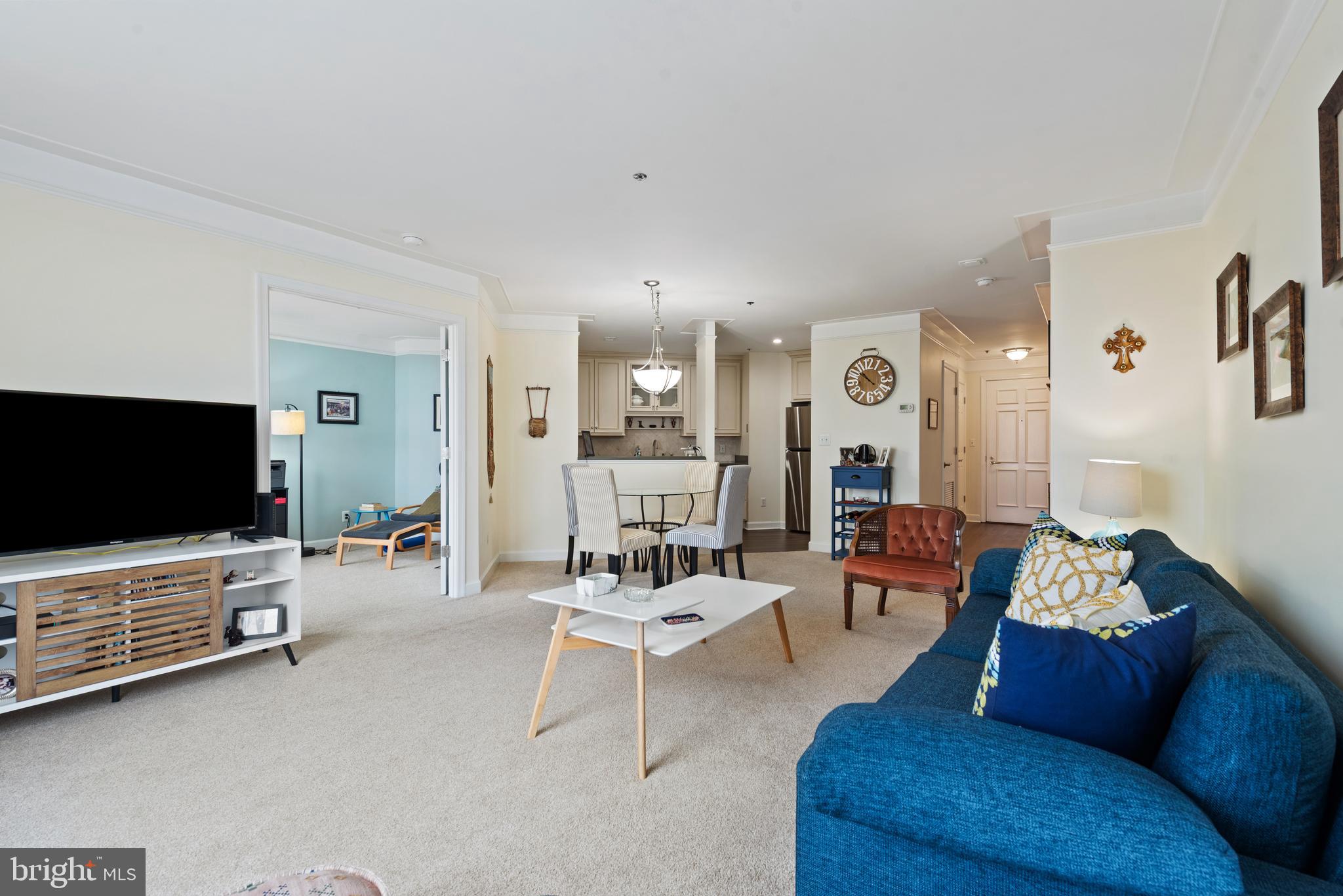 100 Harborview Drive, Unit 612 Baltimore, MD 21230 - Photo 6 of 49 a living room with furniture and a flat screen tv