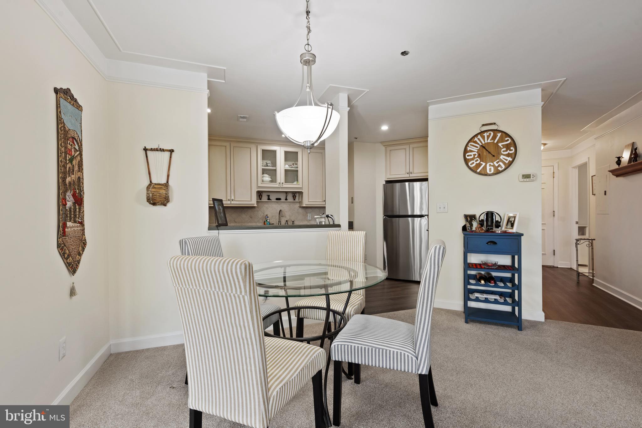 100 Harborview Drive, Unit 612 Baltimore, MD 21230 - Photo 8 of 49 a kitchen with stainless steel appliances granite countertop a refrigerator and a stove top oven