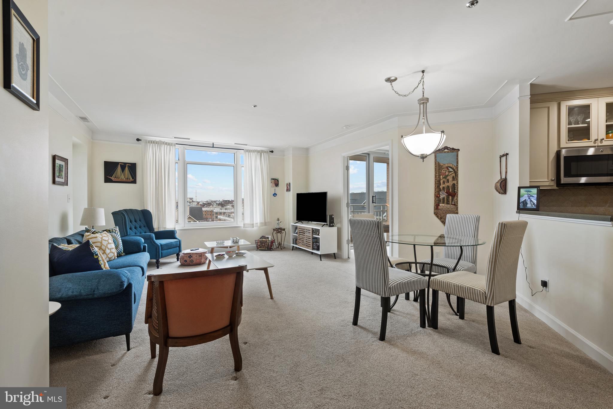 100 Harborview Drive, Unit 612 Baltimore, MD 21230 - Photo 9 of 49 a living room with furniture and a wooden floor