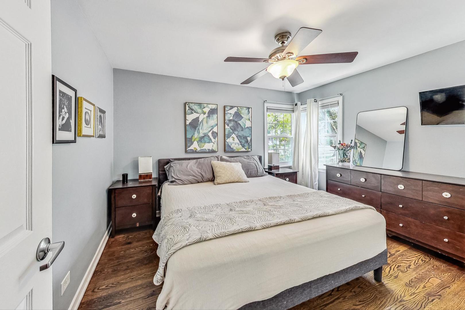 792 Spring Road Elmhurst, IL 60126 - Photo 12 of 26 a bedroom with a bed and a chandelier