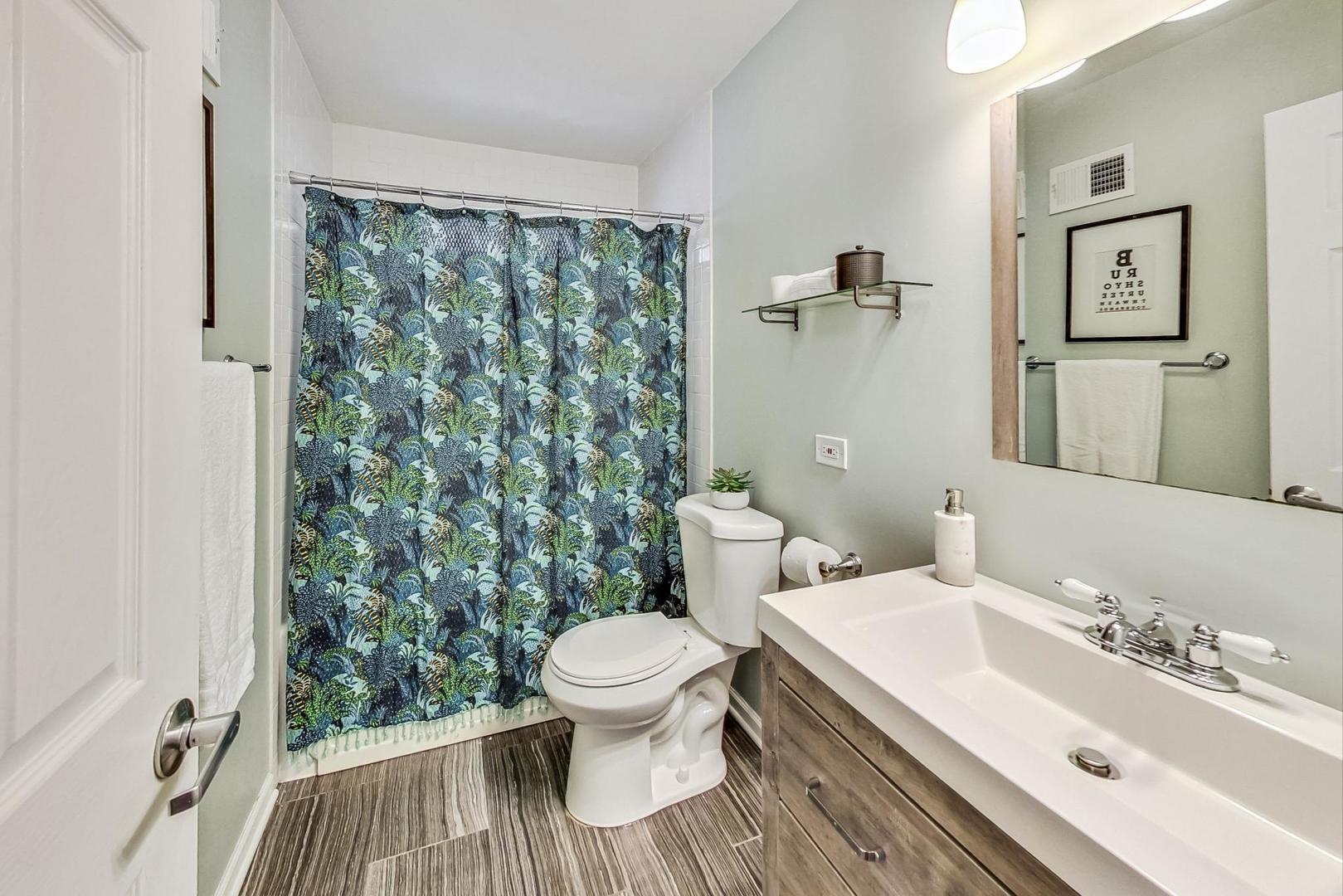 792 Spring Road Elmhurst, IL 60126 - Photo 14 of 26 a bathroom with a sink toilet and shower