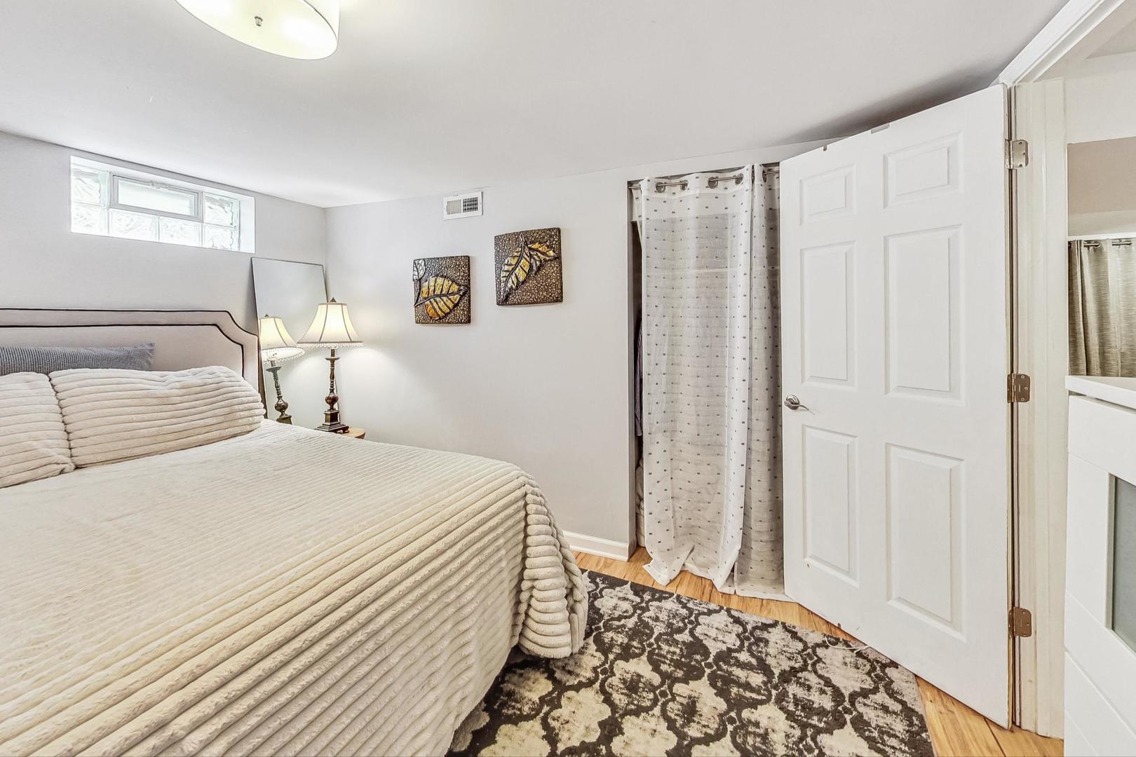 792 Spring Road Elmhurst, IL 60126 - Photo 18 of 26 a bedroom with a large bed and a window