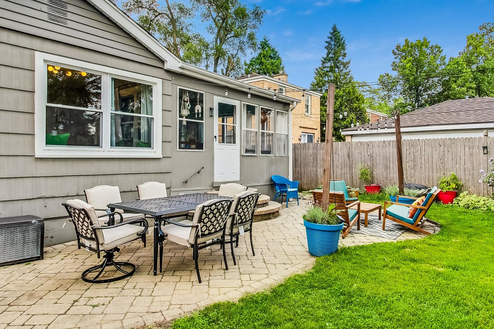792 Spring Road Elmhurst, IL 60126 - Photo 22 of 26 a view of a house with patio and a garden