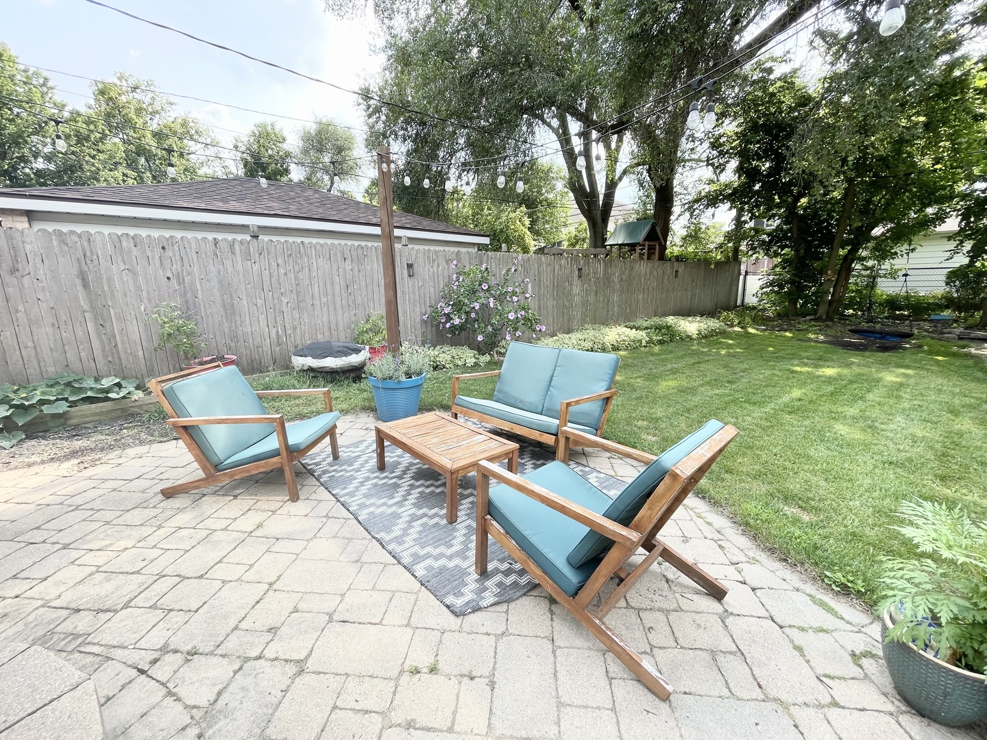 792 Spring Road Elmhurst, IL 60126 - Photo 23 of 26 a view of backyard with a table and chairs