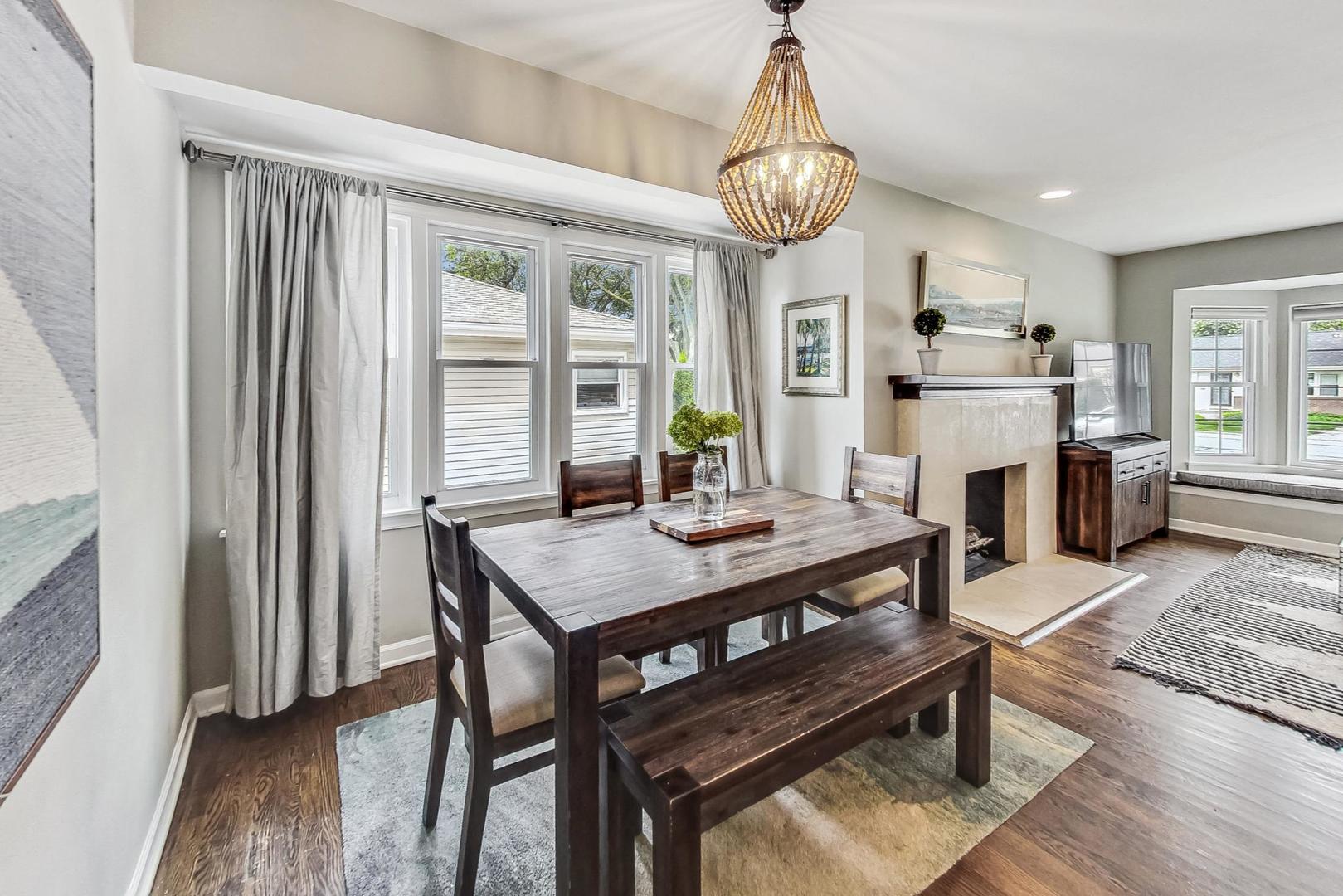 792 Spring Road Elmhurst, IL 60126 - Photo 3 of 26 a view of a dining room with furniture window and wooden floor