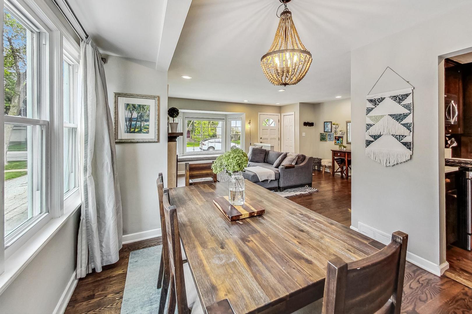 792 Spring Road Elmhurst, IL 60126 - Photo 5 of 26 a view of a dining room with furniture window and wooden floor