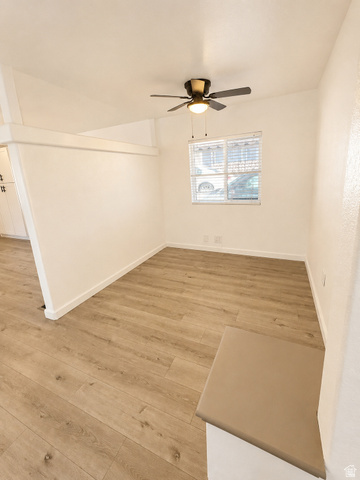 131 Rickie Road Washington, UT 84780 - Photo 23 of 31 Den featuring wood-finish flooring, white walls, and a ceiling fan with integrated lighting